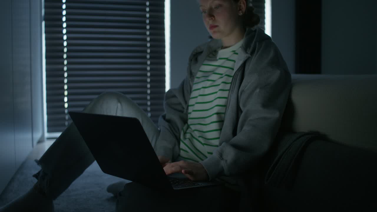 Teenage Girl Using Laptop at Night