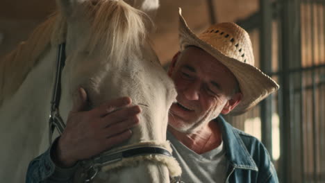 man and horse in stable