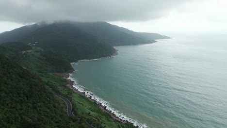 Foggy-Forest-Hills-with-Road-in-Foreground,-Vietnam