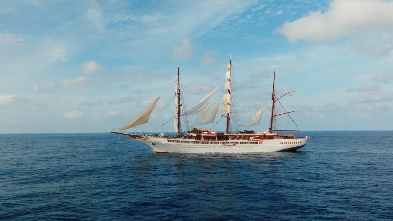 Sea cloud luxury cruise ship sailing vessel in the Atlantic Ocean under blue sky, Drone shot
