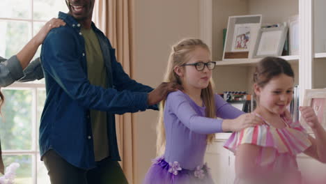 happy multiracial family dancing at home having fun enjoying dance celebrating exciting weekend together