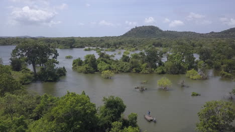 aerial tilts from canoe raft in yala park wetland to lush flooded land