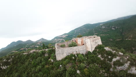 FPV-drone-flying-towards-old-castle-in-tropical-mountain