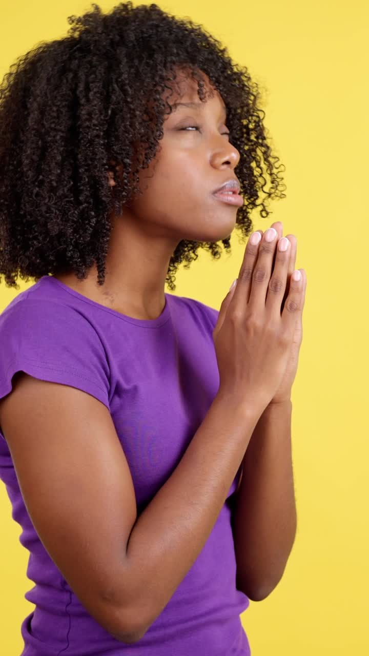 Woman Praying with Clasped Hands