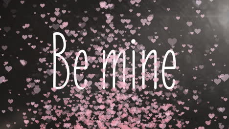 animation of be mine with pink hearts on background