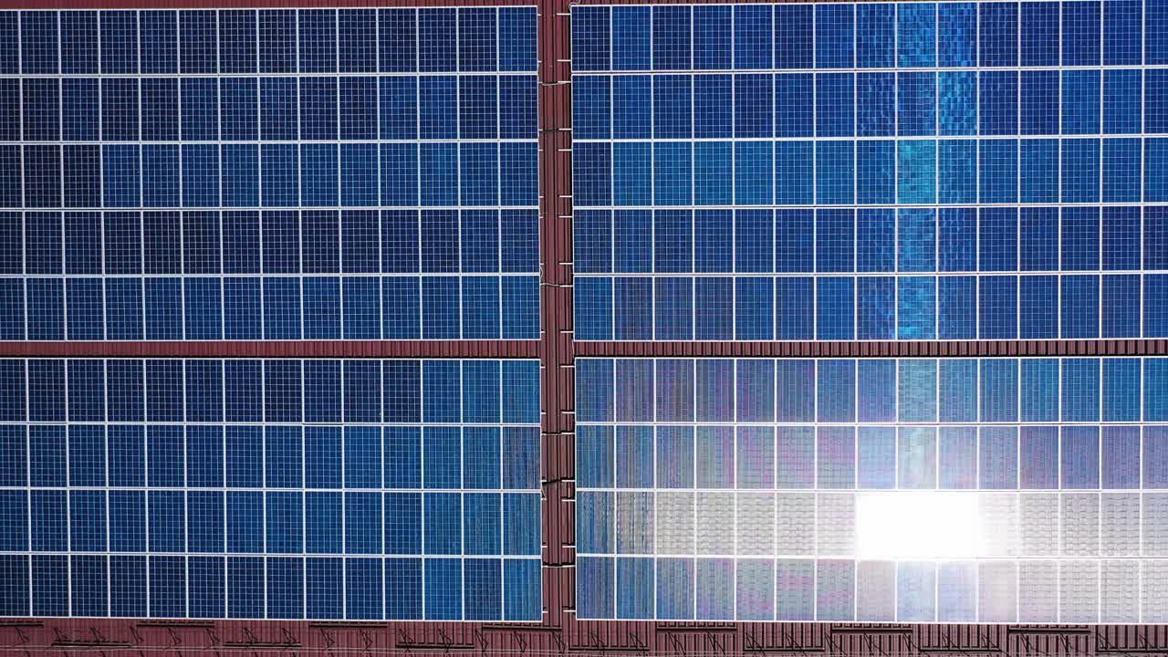 Solar panels from above. Aerial drone view of solar panels on the roof of building
