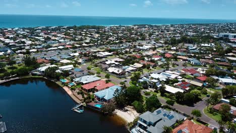 flying above gold coast residential area and shore