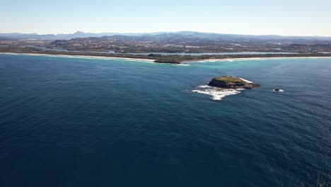 panoramic view of cook island and fingal head on the tasman sea in nsw, australia - drone shot