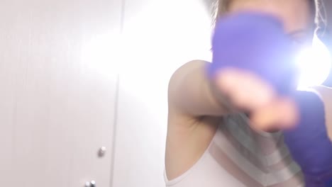 a woman boxer trains before a fight a girl studies combat strikes a woman boxer trains before a fight a girl studies combat strikes professional boxing athlete