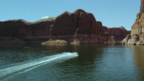 breathtaking lake powell canyon with jet ski waverunner rider, aerial landscape