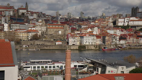 porto city beyond the douro river in porto, portugal, wide shot