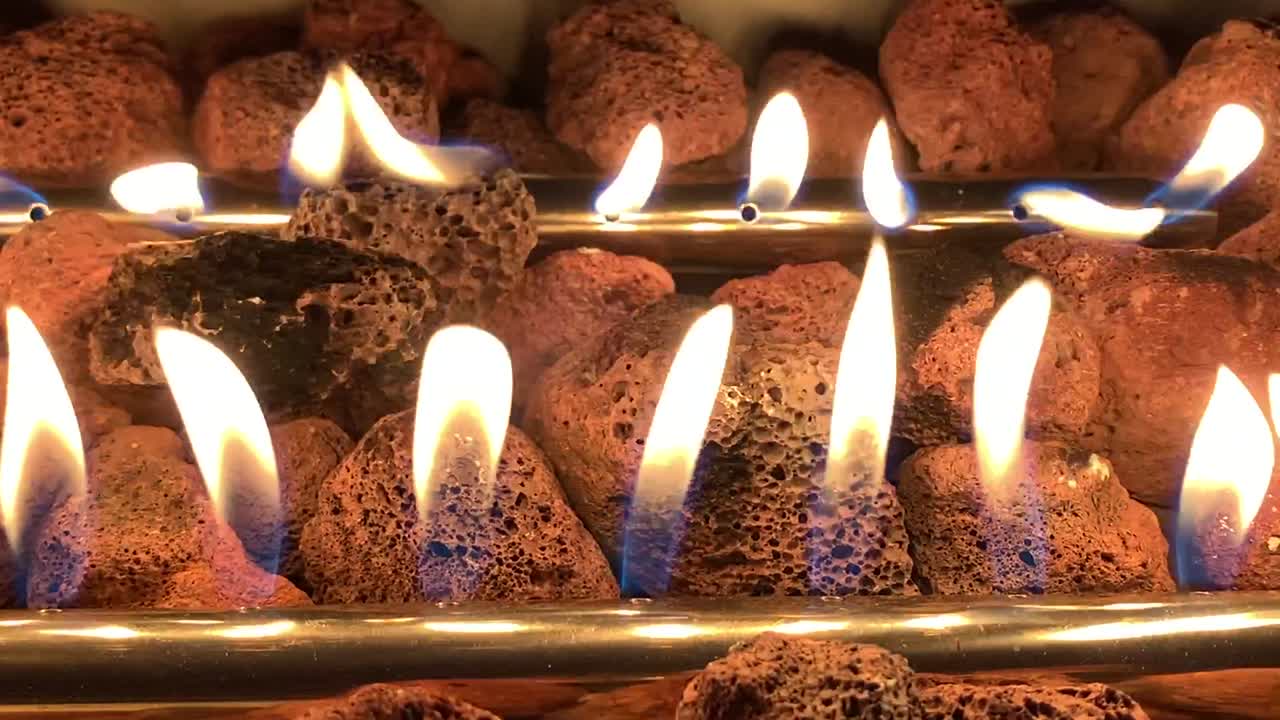 Slow motion close-up of flames from an outdoor fire pit - fire place in 1-4 speed