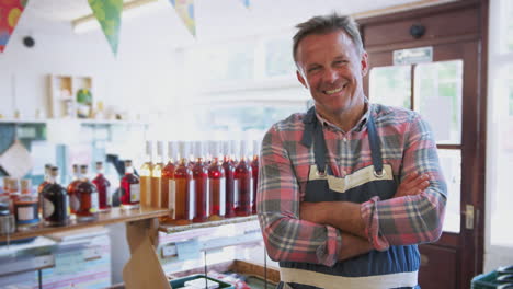 Portrait-Of-Mature-Man-Running-Organic-Farm-Shop