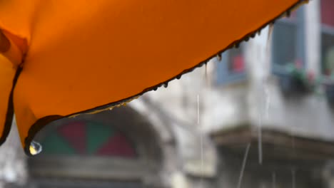 raining outside a cafe umbrella