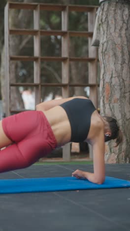 woman performing core exercises outdoors