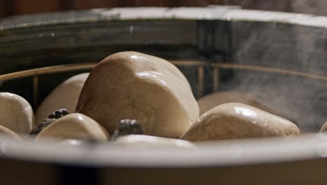 throwing water on the sauna stones in the sauna stove, creating steam to heat the steam room