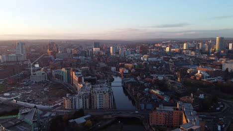 wide angle aerial view of leeds city at golden hour - dolly out