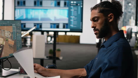 vertical video middle eastern male developer creating property layout with furniture
