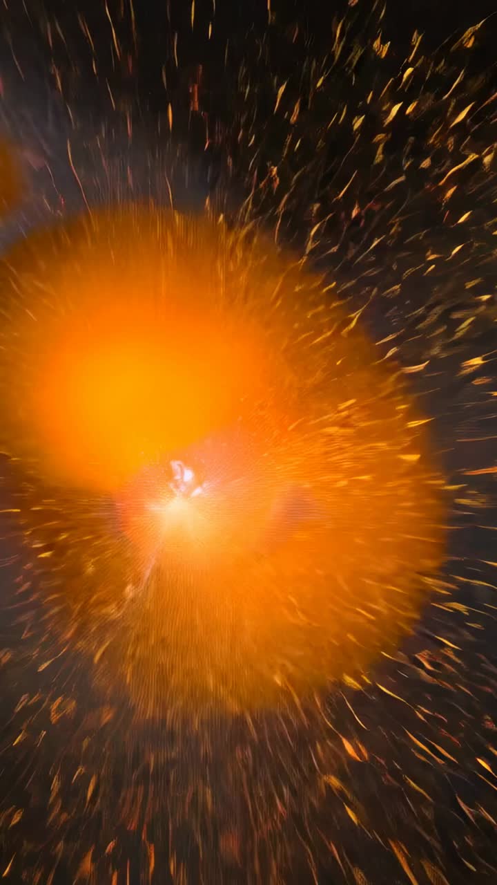 Vertical video: Igniting orange core emitting sparks and smoke across void, showing halo fragment