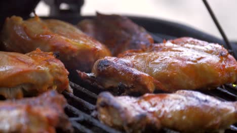 lemon seasoned chicken cooks on the grill in the backyard