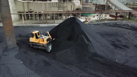 crawler bulldozer loading coal. coal industry. black gold