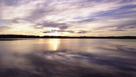 aerial over beautiful lake at sunset