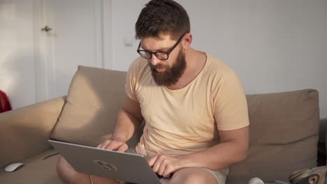 Man working on laptop at home