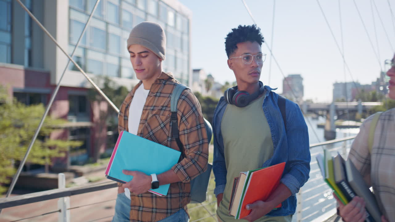 Group of students walking on campus with books