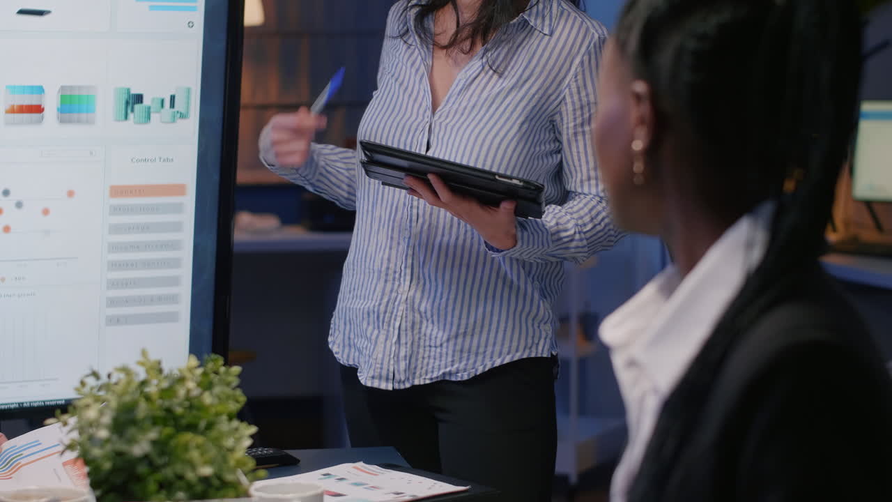 Portrait of woman with business job sitting at office desk
