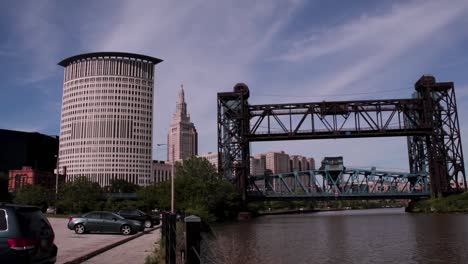 the cleveland skyline as seen from the shore of the cuyahoga river