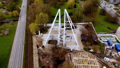 drone overlooks city planning, building a pyramidal structure in latvian roads