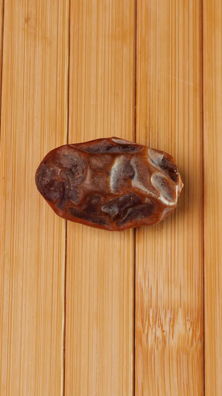 Placing a Medjool Palestinian date on the table