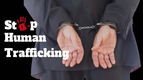 animation of stop human trafficking text over caucasian man with handcuffs