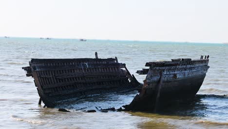 abandoned shipwreck slowly decaying in the sea