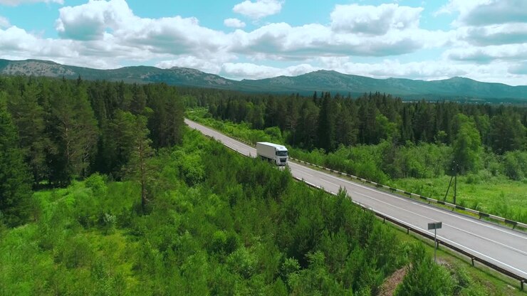 Truck on a scenic highway through a forest