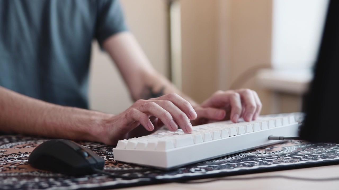Mediumclose Hands Typing On Keyboard, Mouse Beside Keys, Laptop Screen Blurred, Steady Rhythm Of Typing. Media
