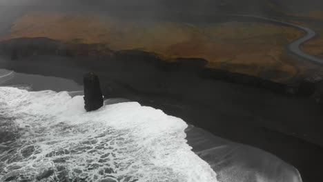 aerial footage over a black beach in djupavogshreppur, iceland-4