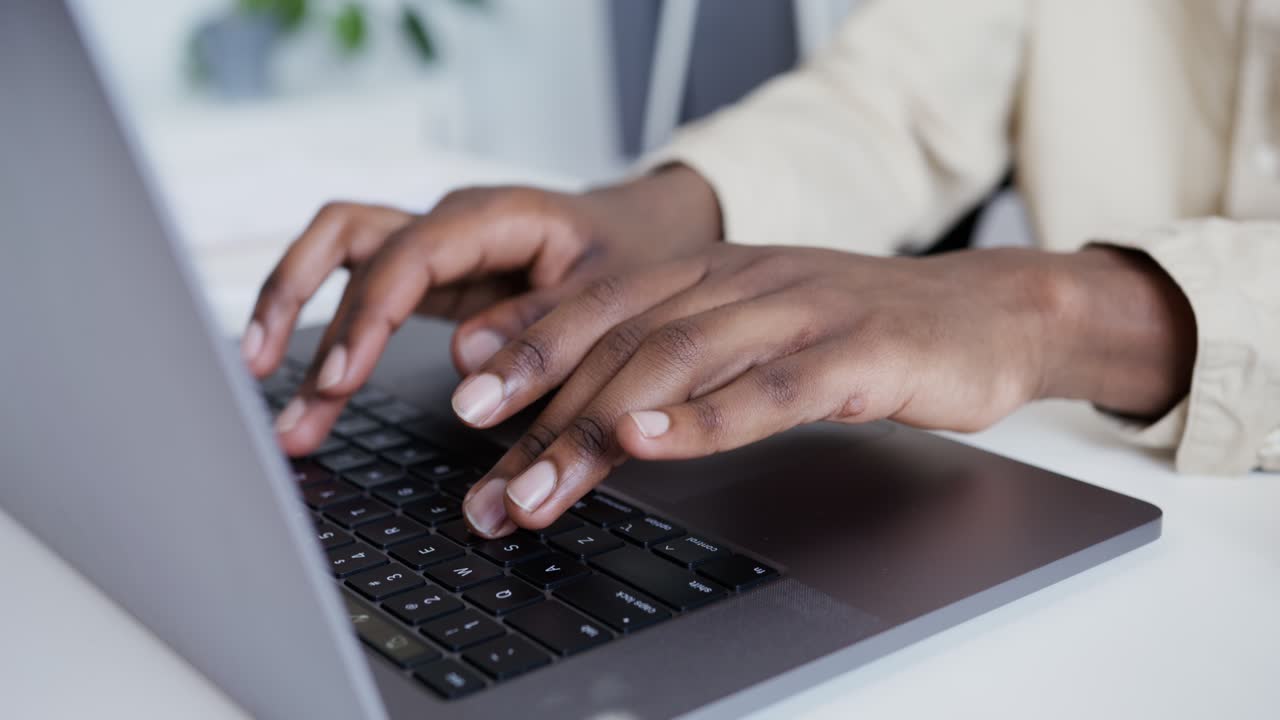 Person Typing on Laptop