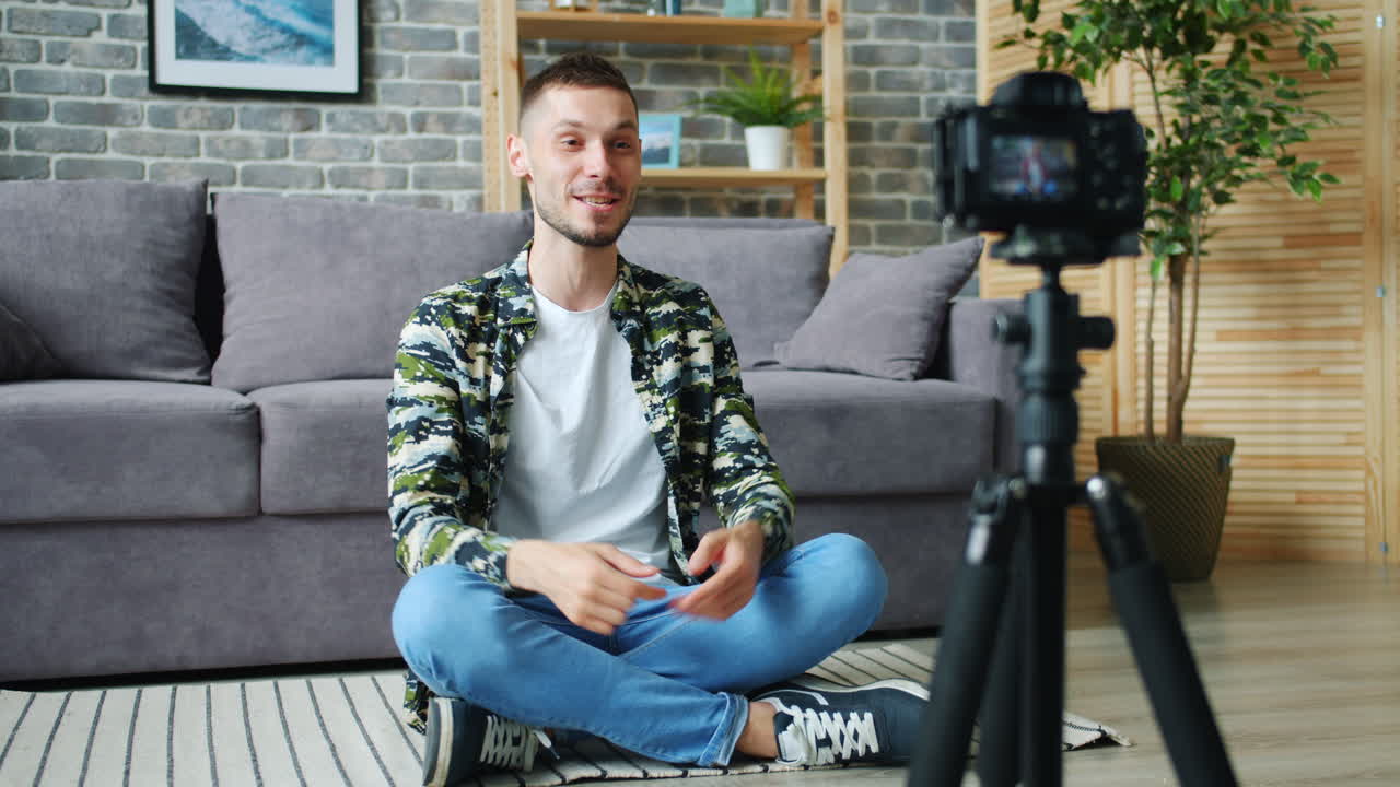 Man vlogging in his living room