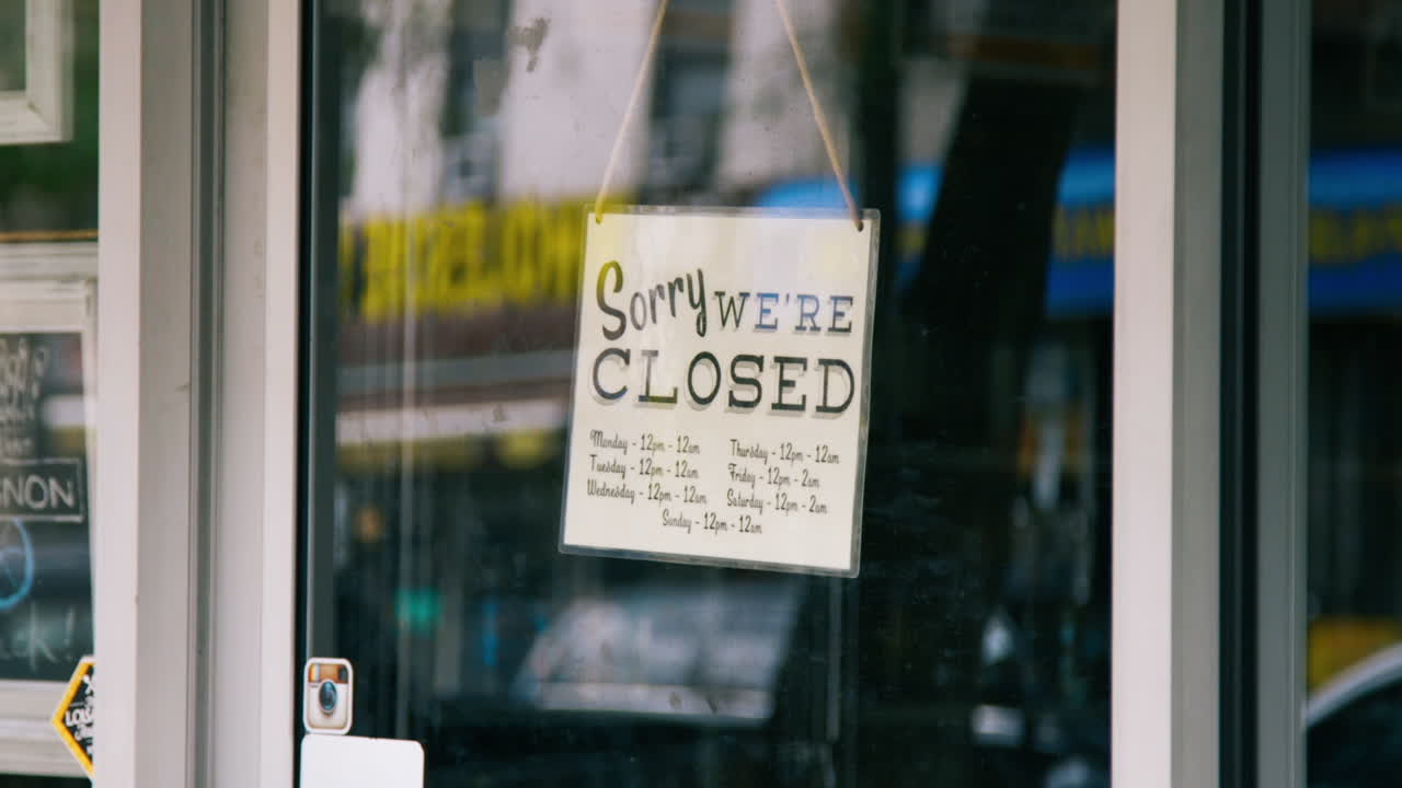 Sorry We're Closed Sign on Store Front