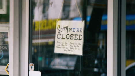 sorry we're closed sign on store front
