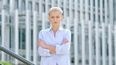 portrait of a confident woman with short blonde hair