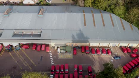 royal mail sorting office with lots of red vans and lorries - dolly left