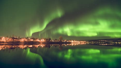 reflections of the northen lights in a calm river in norway