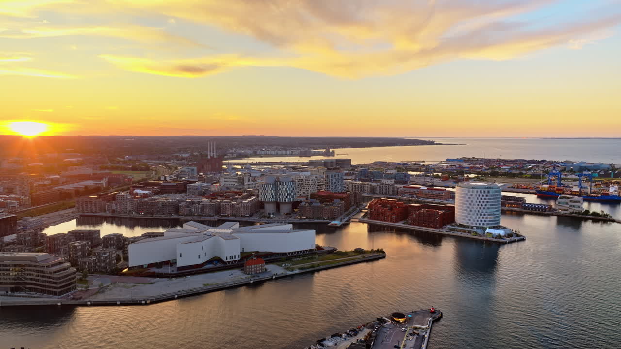 Aerial drone view of Nordhavn harbour area at the coast of the Oresund at sunset