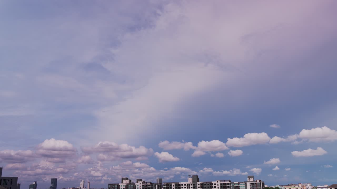 In Bangkok's sky, a canvas vast, clouds dance in the afternoon's cast