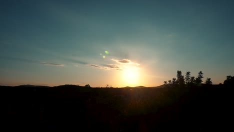 Sunset-Clouds-Through-Fiery-Sunlight-Over-Ridges-In-Tranquil-Village-Near-Valencia,-Spain