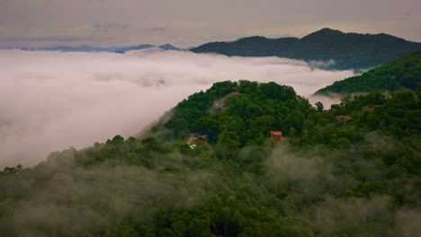 Cinematic drone footage glides above fog-covered Smoky valleys