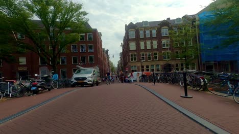 cycling through amsterdam city in the netherlands. - pov hyperlapse shot