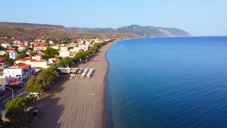 greek island longest vatera beach tavernas, hotels, restaurants surrounded by mountains and sea, lesvos island, panoramic drone view